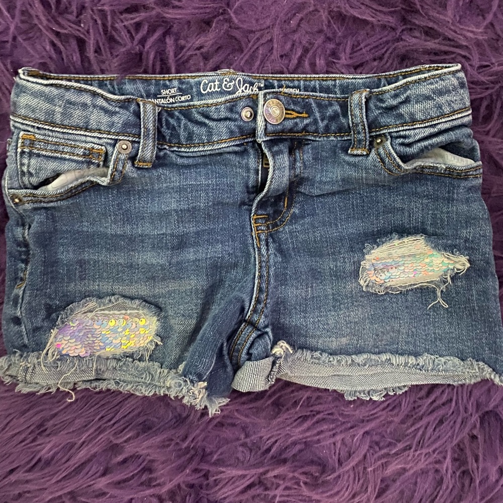 Jean shorts with rips.